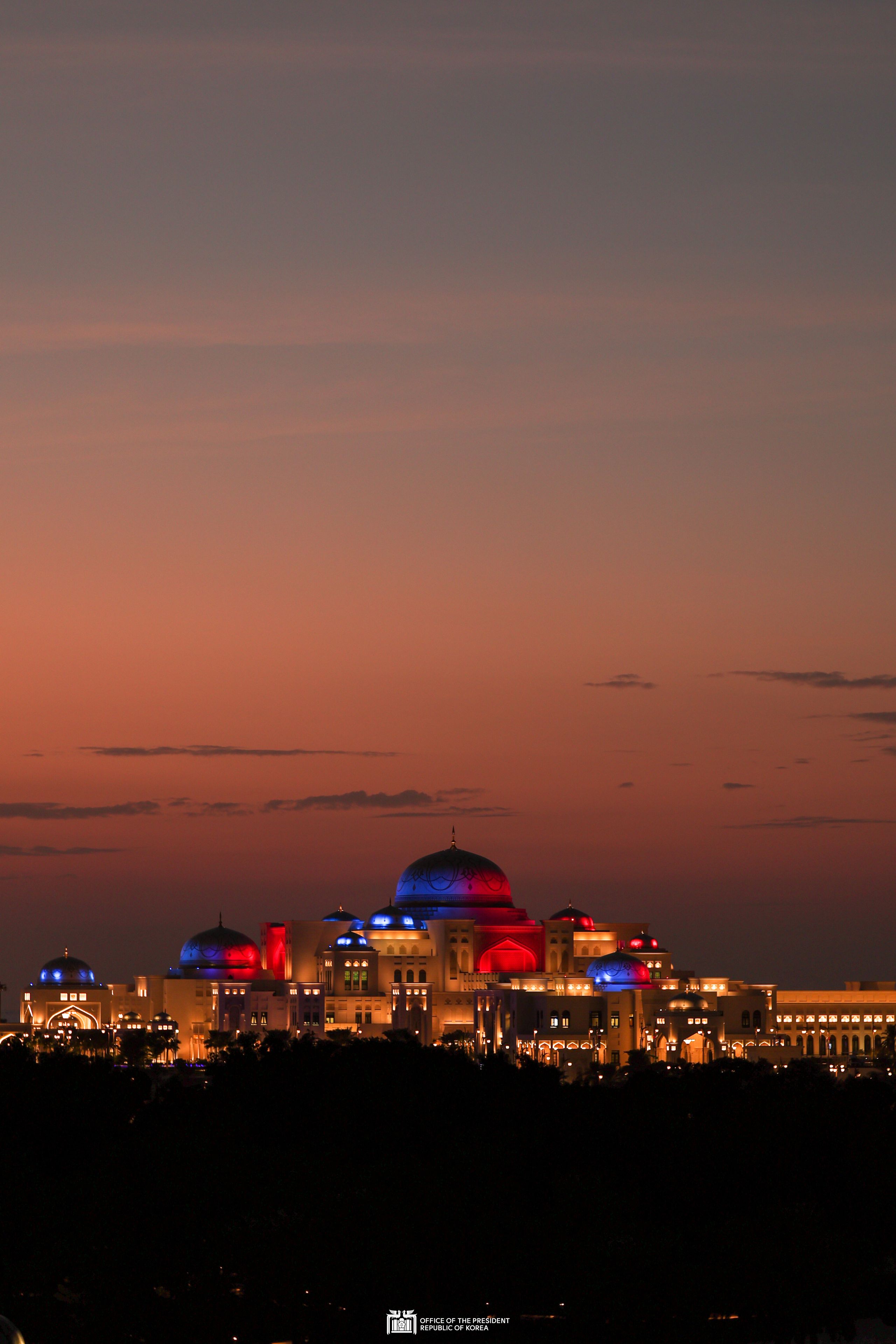 The UAE presidential palace lit up with the colors of Korea’s flag to welcome President Yoon on his state visit slide 1