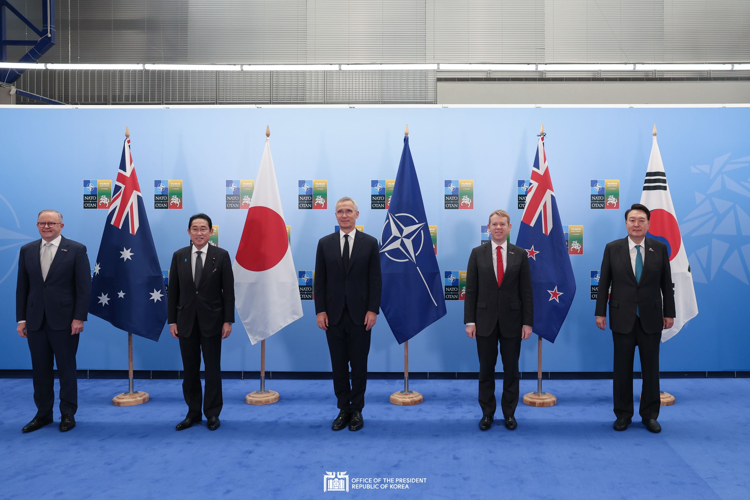 Commemorative photo of the AP4 leaders and the NATO Secretary General in Vilnius, Lithuania slide 1